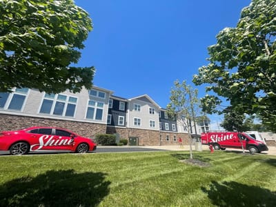 Exterior view of the facility with branded vehicles