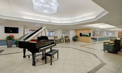 Interior view of a stylish lounge area with a piano