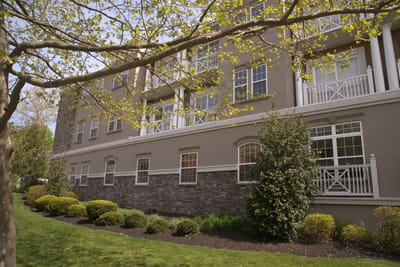 Exterior view of the facility surrounded by greenery
