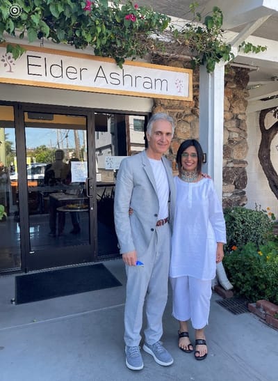 Couple posing in front of Elder Ashram facility entrance