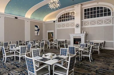 Dining room with white tables and blue chairs