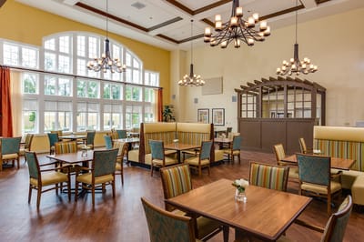 Bright and spacious dining area with tables and chairs