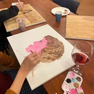 Resident painting in an art activity class