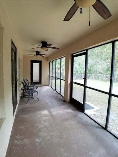 Screened porch area with outdoor seating