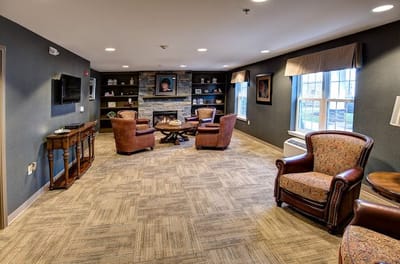 Cozy common area with seating and a fireplace