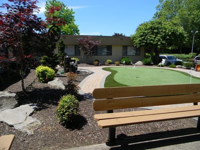 Well-maintained outdoor space with walking paths and greenery