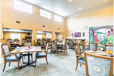Dining room with tables set for residents