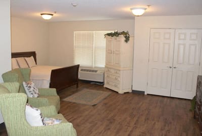 Bright and inviting resident room with furnishings