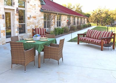 Outdoor seating area with a table and chairs
