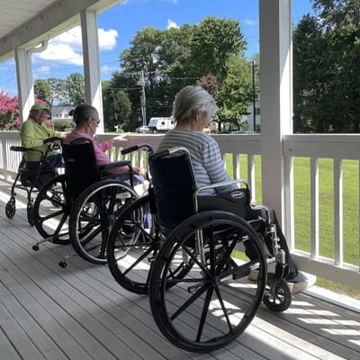 Residents enjoying the outdoor view from wheelchairs