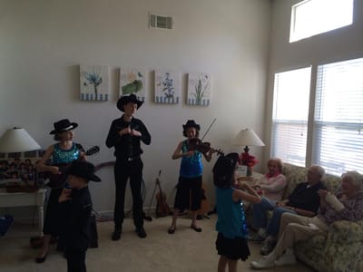Performers entertaining residents in a common area