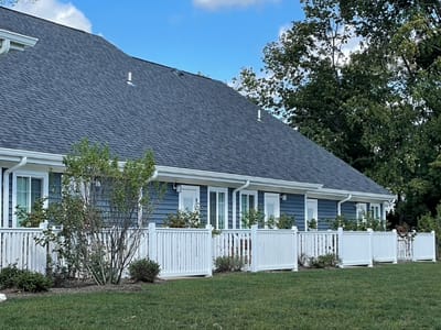 Exterior view of a senior living facility with green space