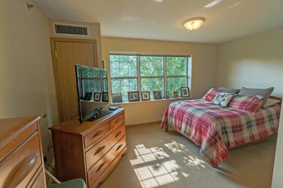 Cozy resident room with a bed and TV