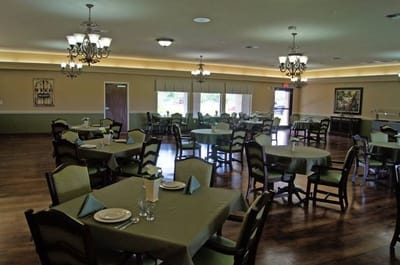 Dining room setup with tables and chairs