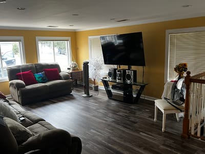 Cozy common area with seating and entertainment system