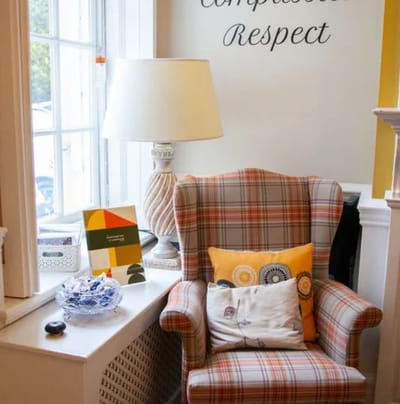 Comfortable chair in a cozy common area with decor