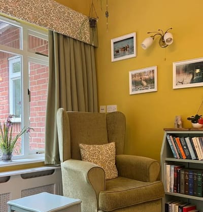 Cozy seating area with green walls and decor