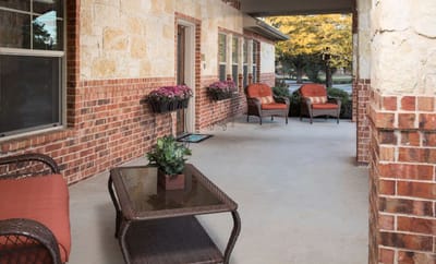 Corridor with seating area and planters