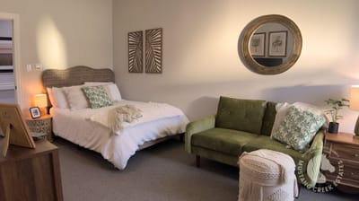 Cozy resident room with bed and seating area
