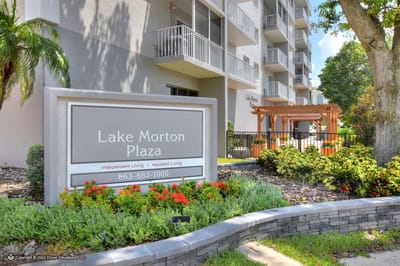 Entrance sign of Lake Morton Plaza with landscaping