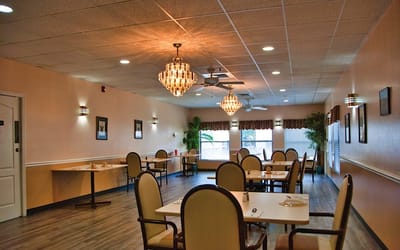 Bright dining room with elegant lighting and tables