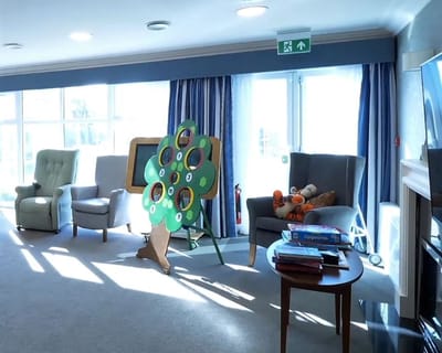 Bright common area with seating and activities
