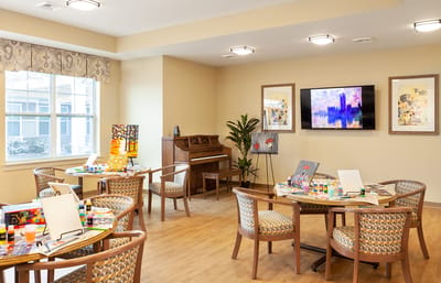 Art activity area with tables and art supplies
