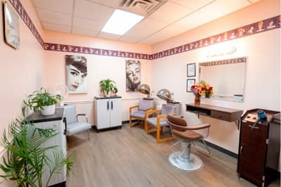Stylish hair salon area with retro decor and plants