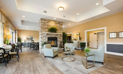 Bright common area with seating and fireplace