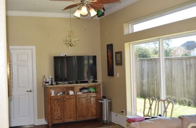 Interior view of a living area with a TV and furniture