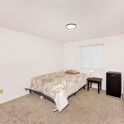 Private resident room with a bed and furniture