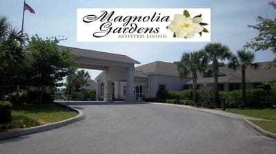 Exterior view of Magnolia Gardens Assisted Living facility with logo