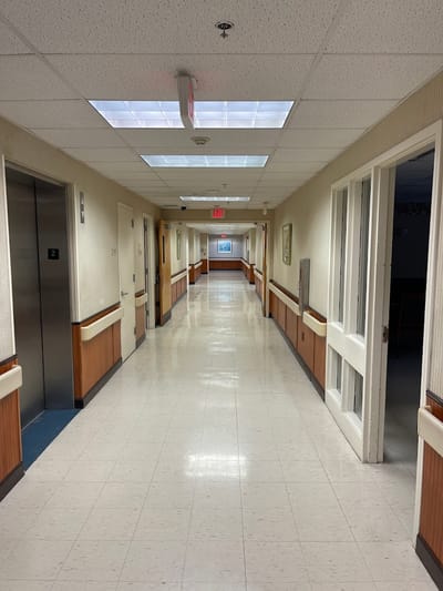 Long corridor with elevators and artwork