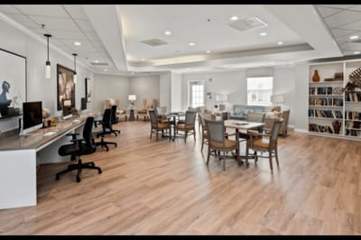 Bright common area with seating and bookshelves