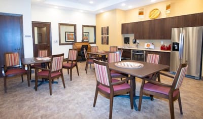 Bright common area with tables and chairs