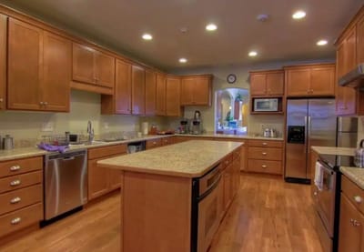 Modern kitchen with wooden cabinets and granite countertops