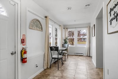 Bright hallway with chairs and large windows
