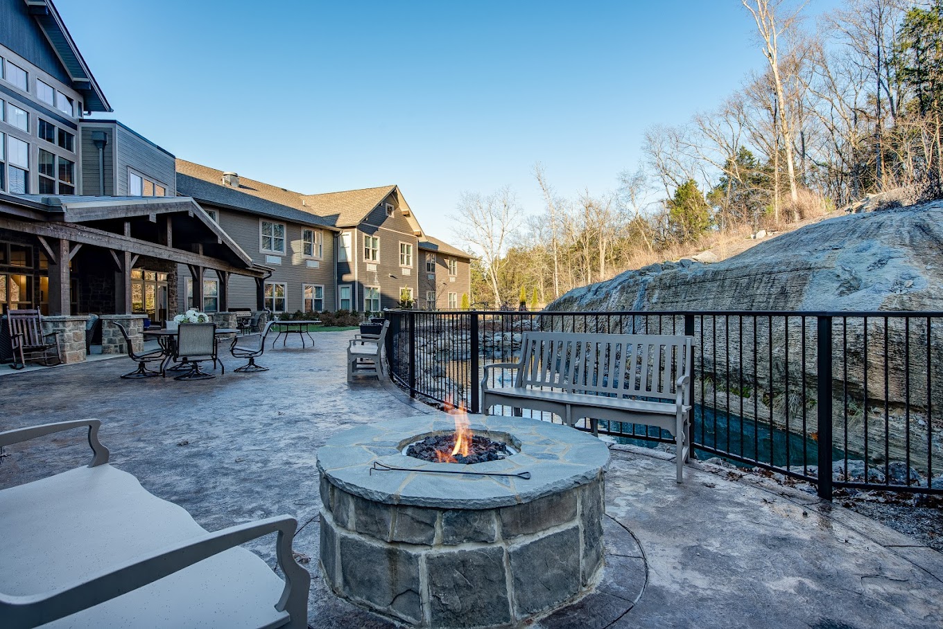 Outdoor patio area with fire pit and seating