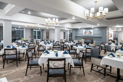 Bright dining room setup with tables and chairs