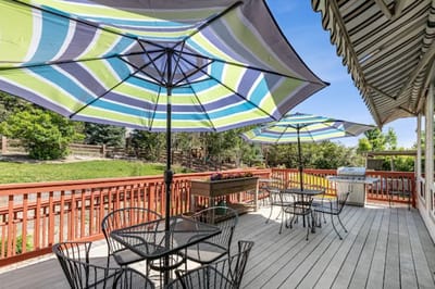 Outdoor seating area with umbrellas and deck