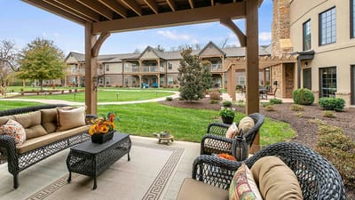 Outdoor seating area with lush garden view