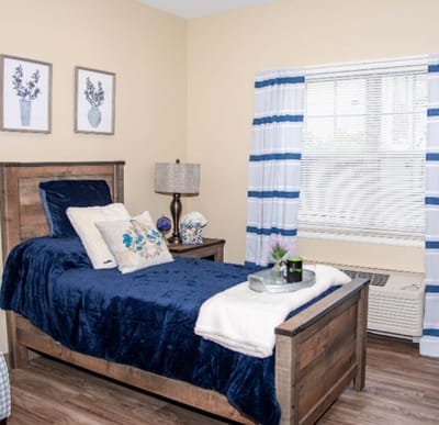 Cozy resident room with a bed and decor