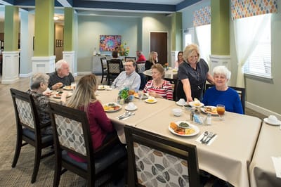 Residents enjoying a meal in the dining room