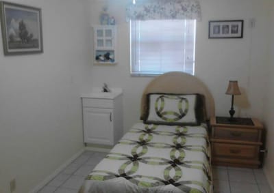 Cozy interior of a resident room with a bed and furnishings