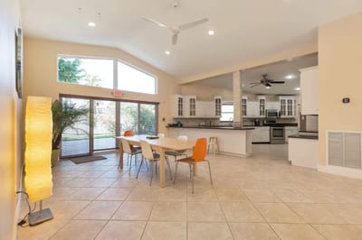Bright interior common area with kitchen and dining space