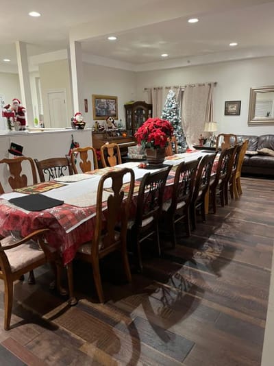 Dining room set up for the holidays with a large table