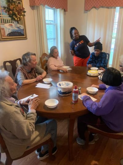 Residents enjoying a celebration at a dining table