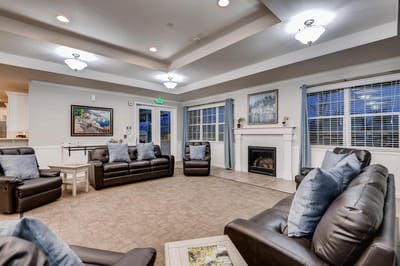 Interior common area with leather seating and fireplace