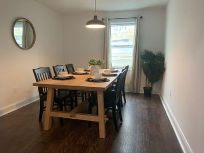 Cozy dining area with a wooden table set for meals