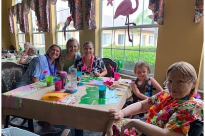 Residents and staff enjoying a vibrant activity in a common area